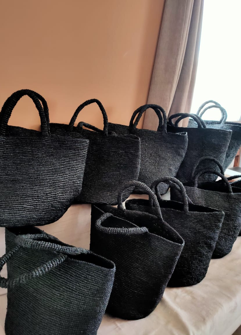 Caramel raffia beach tote bag in black, handwoven in Madagascar