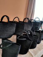 Caramel raffia beach tote bag in black, handwoven in Madagascar
